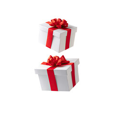 Fototapeta premium Two white gift boxes stacked, adorned with red ribbons