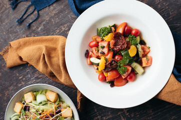 Colorful Tomato and Cucumber Salad with Croutons Overhead Shot