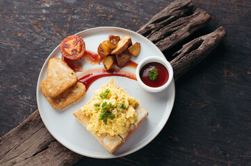 Delicious Breakfast Plate Scrambled Eggs, Toast, and Hash Browns