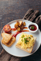 Overhead View of Hearty Breakfast Plate with Scrambled Eggs and Potatoes