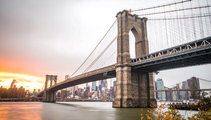 Obraz premium Brooklyn Bridge at Sunset over the East River.