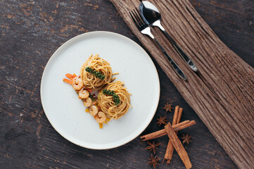 Overhead View of Shrimp Scampi Pasta on Rustic Background