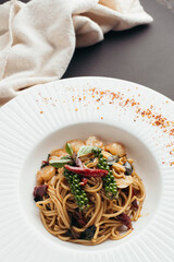 Overhead View of Spicy Shrimp Spaghetti with Herbs on White Plate