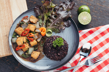 Pan Fried Tofu with Black Rice and Salad Overhead View of Asian Inspired Dish