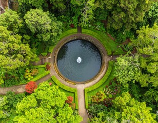 Aerial view of a formal garden with a central pond and fountain