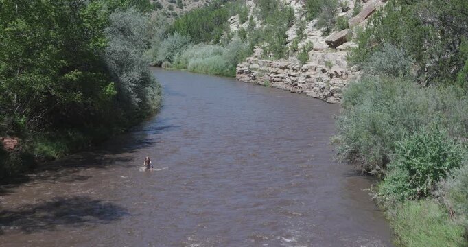 Kid Playing in Pecos River in New Mexico