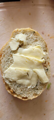 Freshly sliced, warm bread served alongside rich, creamy butter makes for a delightful treat