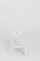 An Elegant White Step Stool, perfect for enhancing your Home and Office Decor in style