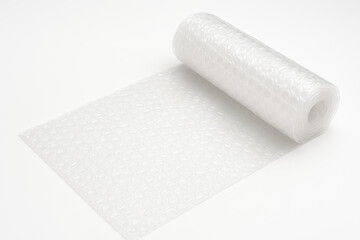 Close-up of white bubble wrap roll partially unrolled, showing texture and protective air pockets, isolated on a clean white background