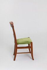 This is an Elegant Wooden Chair featuring Green Upholstery that truly enhances any space