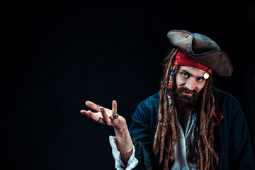 Charismatic pirate with tricorn hat, dreadlocks, and red bandana on black background