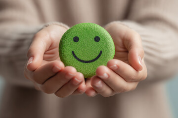 Hands holding green happy smile face , good feedback rating,positive customer review, experience, satisfaction survey ,mental health assessment, child wellness,world mental health day, Compliment Day