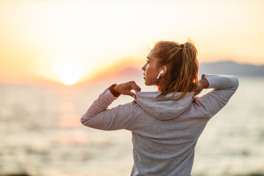 Woman Enjoying Sunset After Running