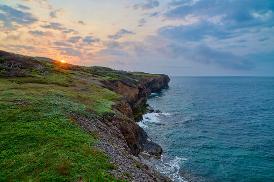 Sunrise above rugged sea cliffs at Cape St. George on the Port au Port Peninsula on southwest coast of Newfoundland. - Powered by Adobe