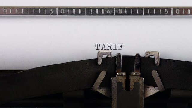 The phrase TARIFF POLICY is typing on a retro typewriter.