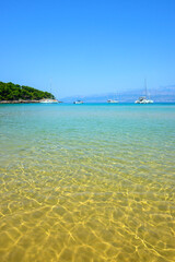 Lovrecina beach, long sandy bay with shallow sea. Brac island, Croatia