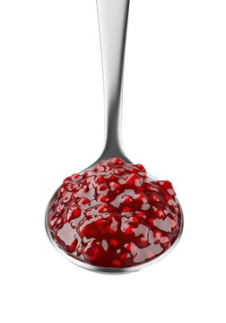 Polished silver tablespoon with glossy, ruby-red raspberry jam, visible fruit pieces and seeds, isolated on a transparent background, inviting culinary perfection concept