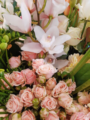 Close up of beautiful natural white and pink flowers. A big bouquet of roses, hyacinths and bulbs background. Gardening and flowering plants.
