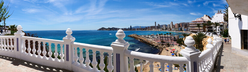 View from Mediterranean balcony over beach, promenade and skyline of Benidorm on the spanish...