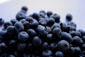 Pile of fresh Healthy organic blueberries isolated on pale background