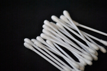 Cotton sticks for ear cleaning on the black background