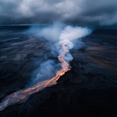 Obraz premium Aerial Drone View of Flowing Lava River Cutting Through Dark Volcanic Plain Beneath Smoky Sky