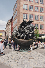 The Narrenschiffbrunnen represents fools on a ship, and the sculpture  is located close to the main market of Nuremberg