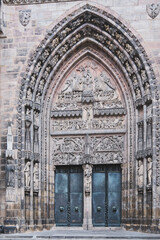 Portal of the Gothic Frauenkirche on Hauptmarkt, Nuremberg, Germany. 