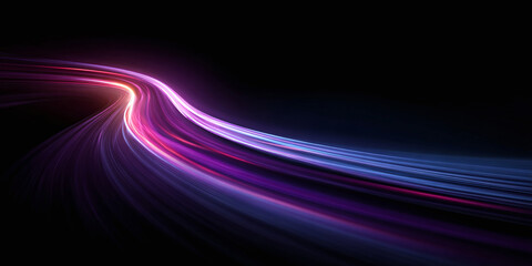 Abstract light trails on black background create a futuristic effect