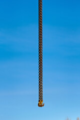 This image shows a chain hanging from a hook