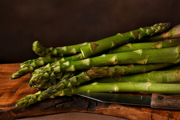 Asparagus on a wooden cutting board