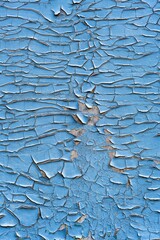 This image shows a close-up of a surface with peeling paint