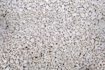 This image shows a close-up view of a surface covered with small irregularly shaped rocks or pebbles