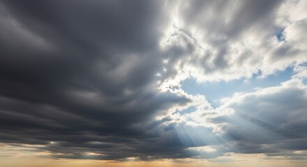 Obraz premium Dramatic Sky with Sunbeams Breaking Through Clouds Atmospheric Landscape Photography for Nature and Travel Themes