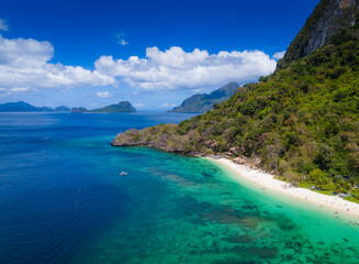 Seven commandos beach in El Nido, Palawan, Philippines islands. Aerial drone view. Top view of beautiful turquoise beach, with white sand and palms
