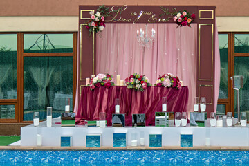 This image shows a beautifully decorated stage or platform for an event likely a wedding or a...