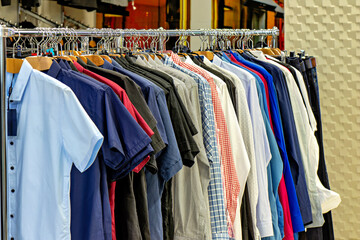 This image shows a rack of shirts in a store