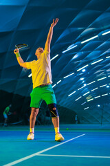 Man playing tennis on a court