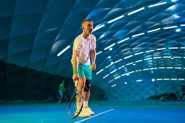 Man playing tennis on a court