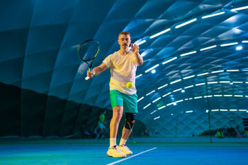 Man playing tennis on a court