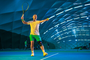 Man playing tennis on a court