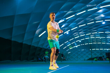 Man playing tennis on a court
