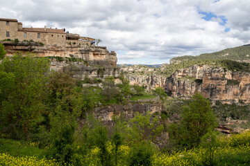 View from Siurana viewpoint over the reservoir, village, and Church of Santa Maria de Siurana in Tarragona, Catalonia, Spain.