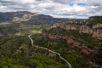 View from Siurana viewpoint over the reservoir, village, and Church of Santa Maria de Siurana in Tarragona, Catalonia, Spain.