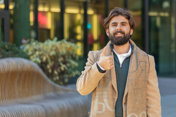 Like. Happy Indian business man raises thumb up agrees with something or gives positive reply...