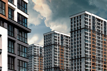 Contemporary tall residential building in developing metropolitan downtown. Multistorey condominium