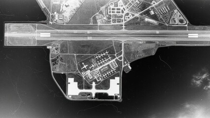 An old, black and white aerial reconnaissance photograph of an airfield or military base.