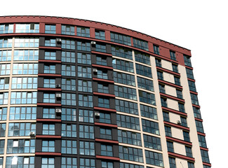 Modern multistorey condominium building with glass facade, balconies and contemporary design in