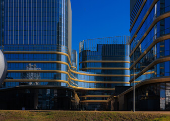 City view, modern buildings and skyscrapers against the blue sky.