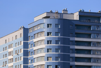 City view, modern buildings and skyscrapers against the blue sky.